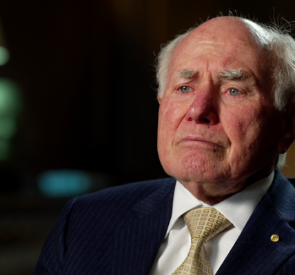 John Howard critiques Donald Trump, stating he is "not compatible with democracy" in a recent interview.