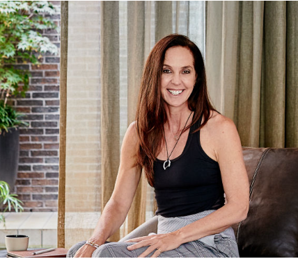 Janine Allis, a successful Australian businesswoman and entrepreneur, is smiling and looking confident.