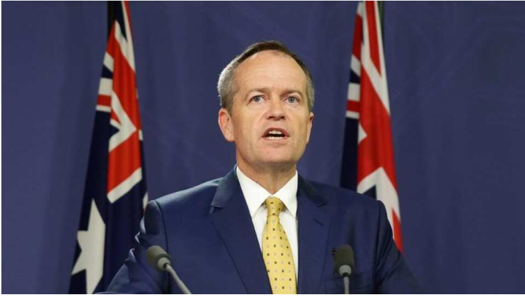 Portrait of Bill Shorten, an Australian politician, smiling confidently, with a backdrop of the Australian Parliament House.