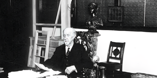 T. B. Walker, a distinguished businessman known for his contributions to the lumber industry and the arts, standing in front of his historic art gallery in Minneapolis.