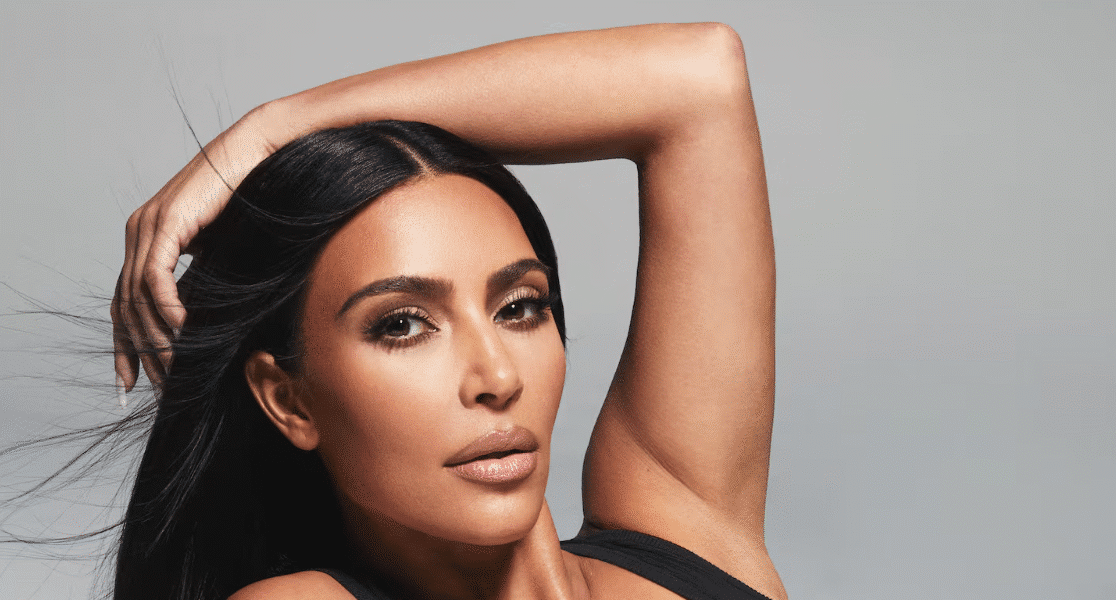 Kim Kardashian at a fashion event, representing her influence as a businesswoman and media icon