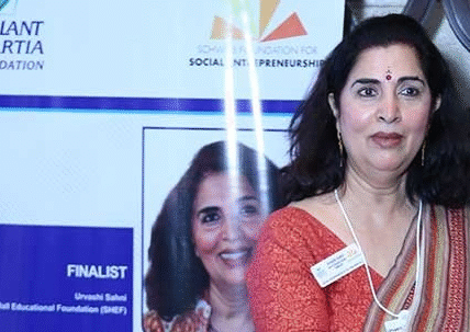 Portrait of Dr. Urvashi Sahni speaking at an education conference, founder of Study Hall Educational Foundation promoting feminist education.