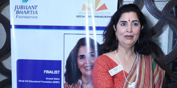Portrait of Dr. Urvashi Sahni speaking at an education conference, founder of Study Hall Educational Foundation promoting feminist education.