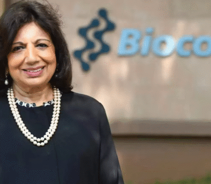 Kiran Mazumdar-Shaw smiling in a professional portrait, wearing a formal blazer, representing her role as a leading Indian biotech entrepreneur.