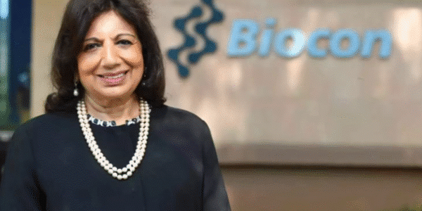 Kiran Mazumdar-Shaw smiling in a professional portrait, wearing a formal blazer, representing her role as a leading Indian biotech entrepreneur.